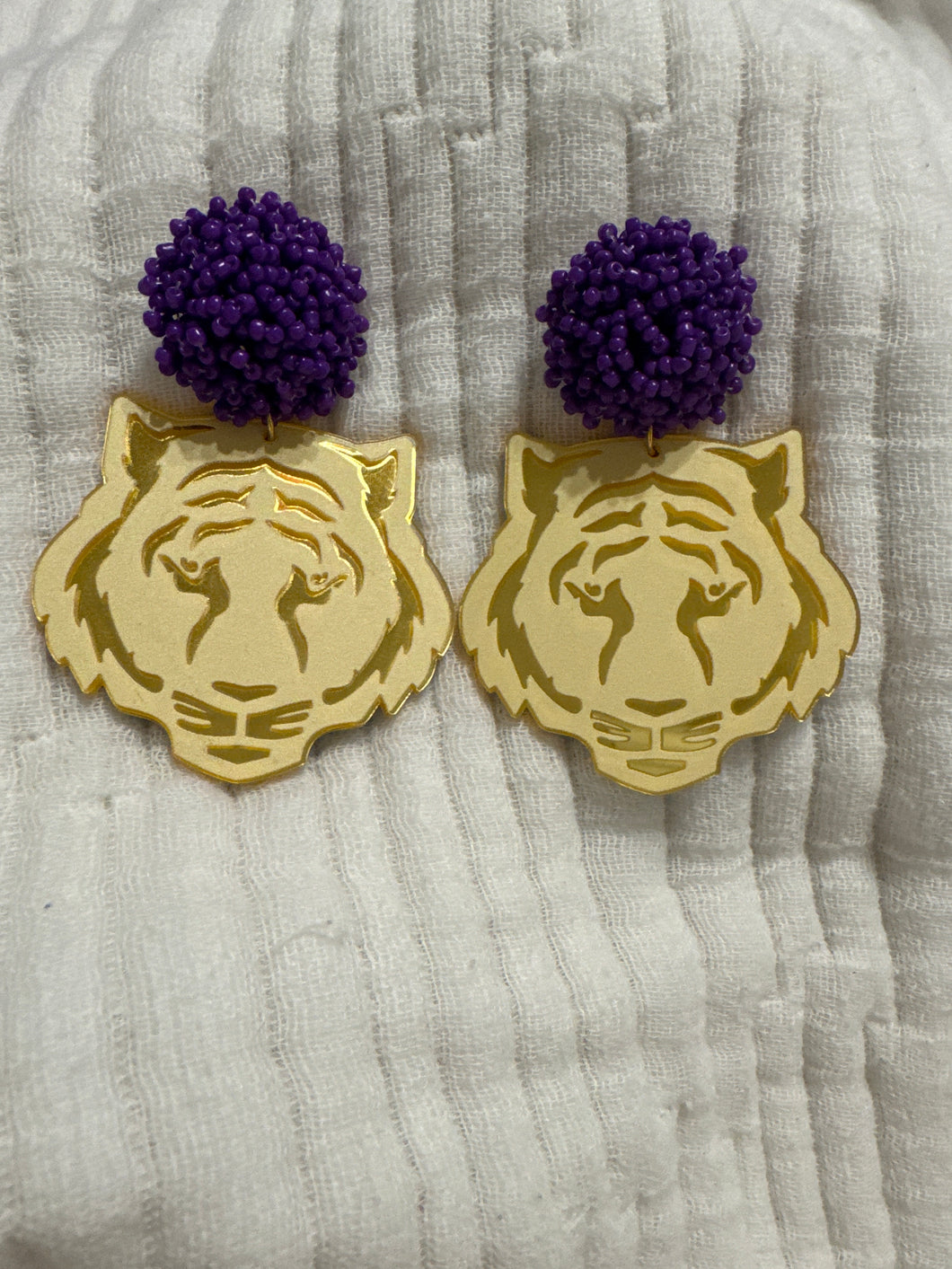 Tiger earrings with purple poms